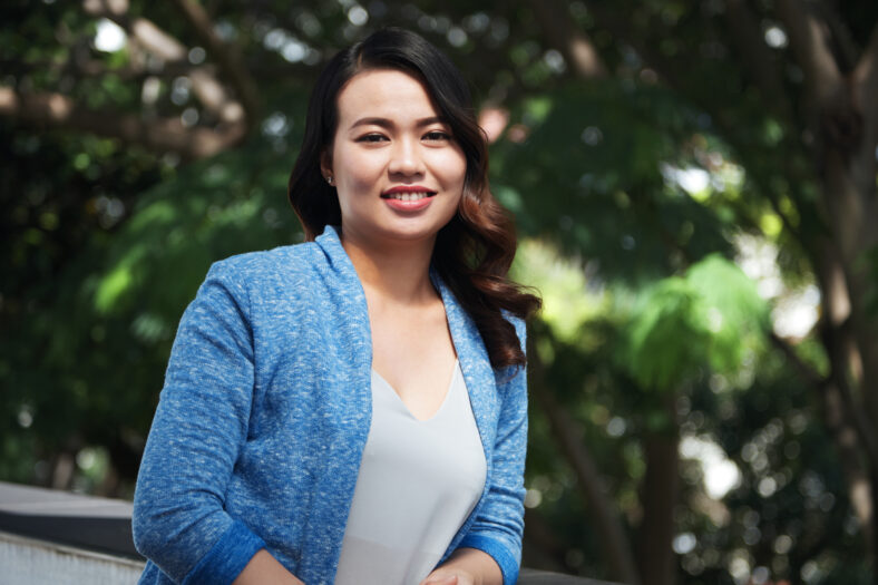Portrait of beautiful Asian woman smiling at camera