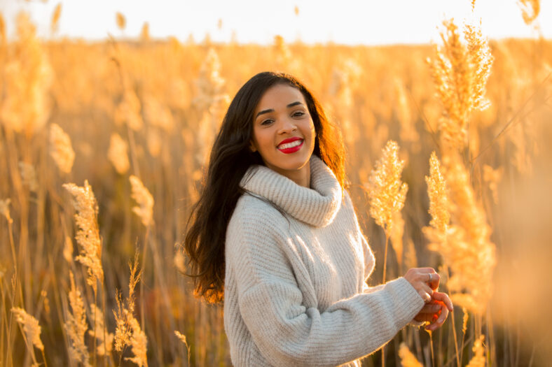 happy woman posing on the nice sunset countryside