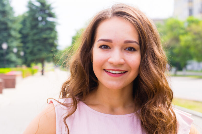 Portrait of young woman on the street