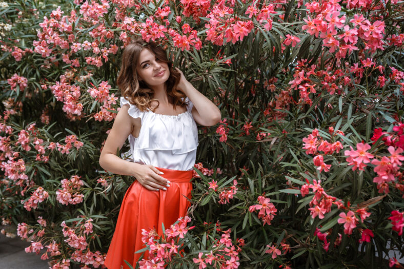 alluring brunete resting at retro villa hotel . Stylish rich slim girl in dress with healthy glossy hair at hotel villa.