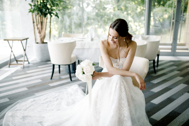 Beautiful bride wearing a fashion wedding dress in a beautiful restaurant