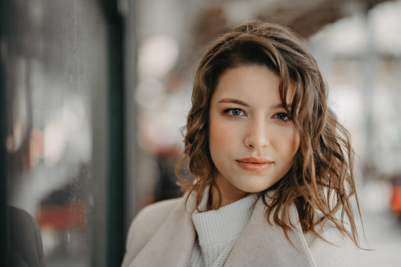 trendy girl posing at the city .natural make-up and stylish styling