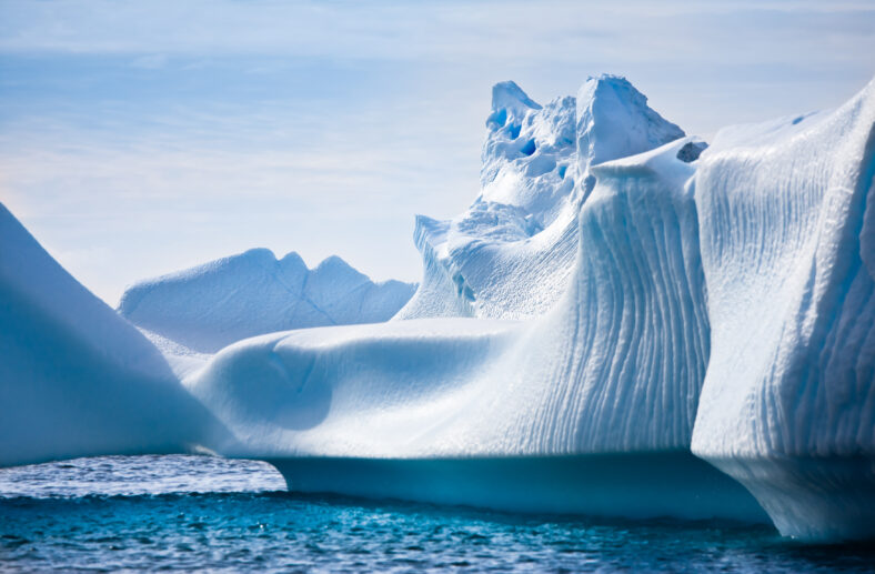 Antarctic iceberg in the snow. Beautiful winter background.