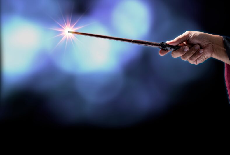 Magic wand on mysterious background, Miracle magical stick Wizard tool on black