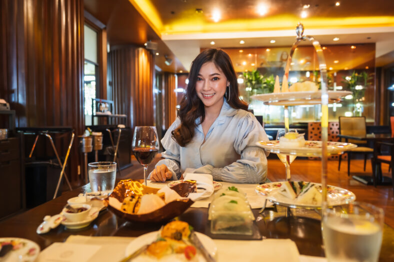 young beautiful woman eating in the restaurant
