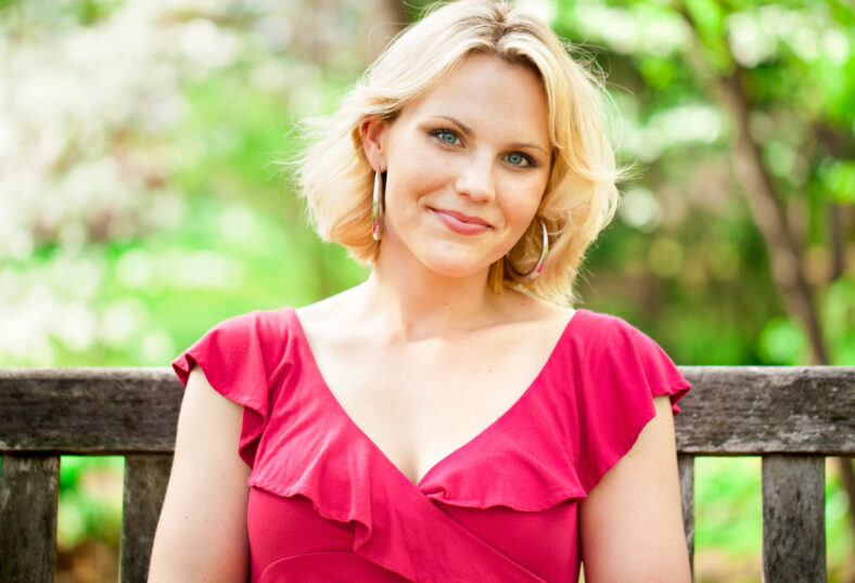 Beautiful woman sitting on a park bench