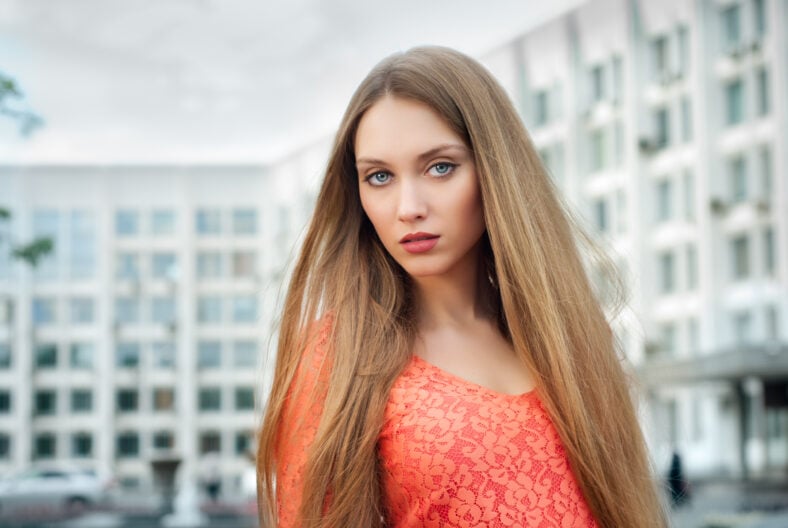 Beautiful young blonde female in street scene