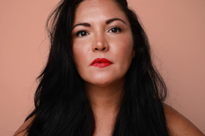 Portrait of pretty thoughtful woman with serious expression. Close-up. High quality photo.
