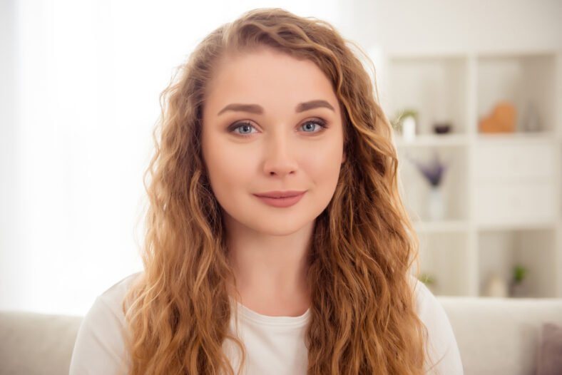 Photo of charming pretty redhead woman smile look camera indoors home.