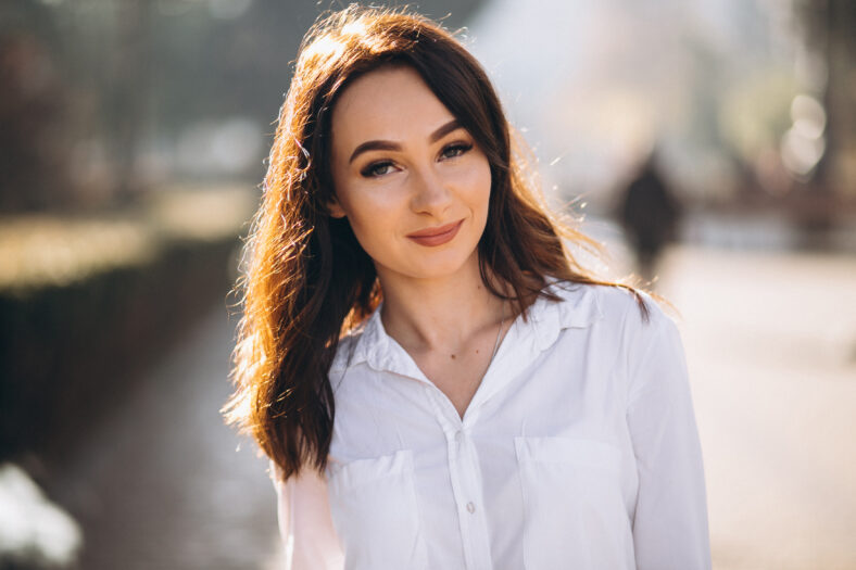 Portrait of woman in white shirt