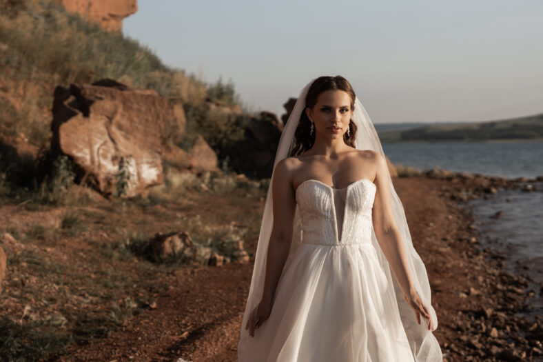 bride standing on a beach