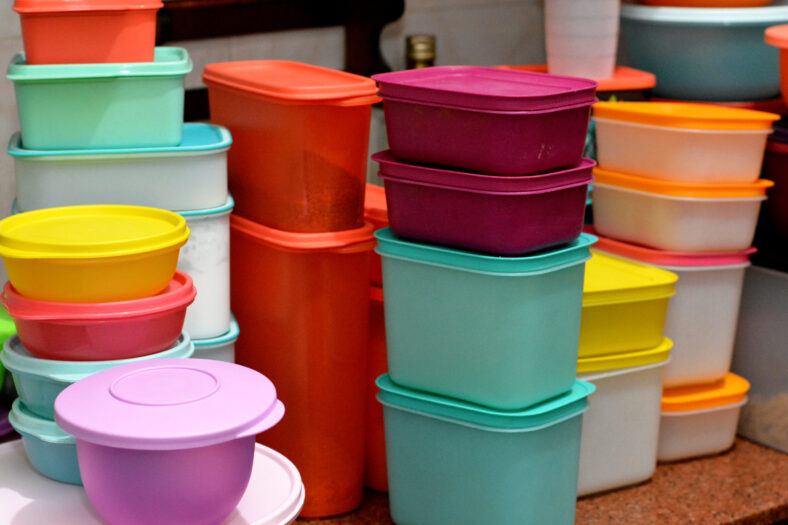 pile of several and many Tupperware plastic products, Tupperware Corporation, an American multinational company produces plastic food storage containers and bottles