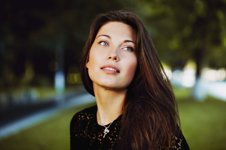 young woman in a park posing