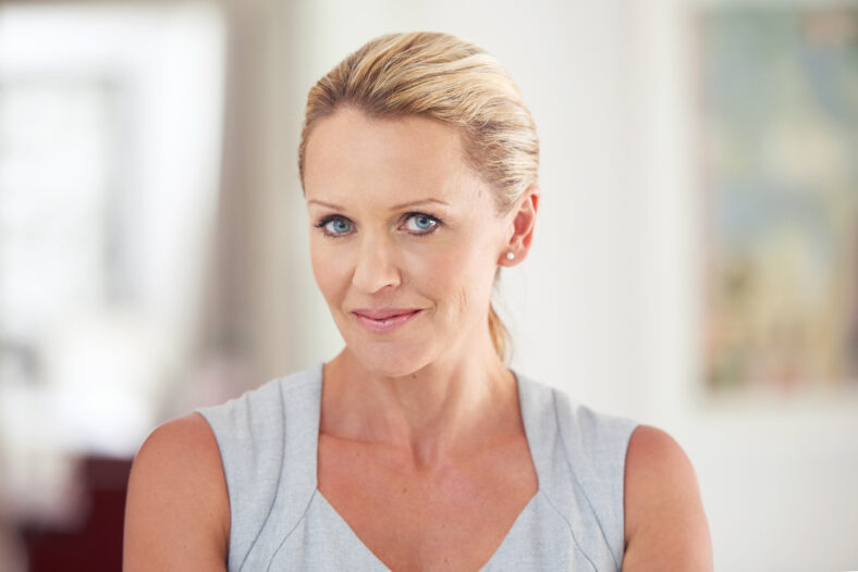 Businesswoman, office or portrait with smile for career or confident, empowerment in finance or accounting. Female accountant, workplace or professional with pride in corporate company, happy for job.
