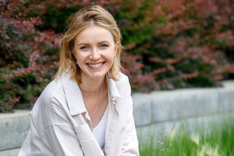 Portrait of a beautiful middle aged blonde woman in the park