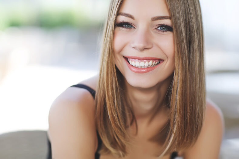 Beautiful girl in a summer cafe