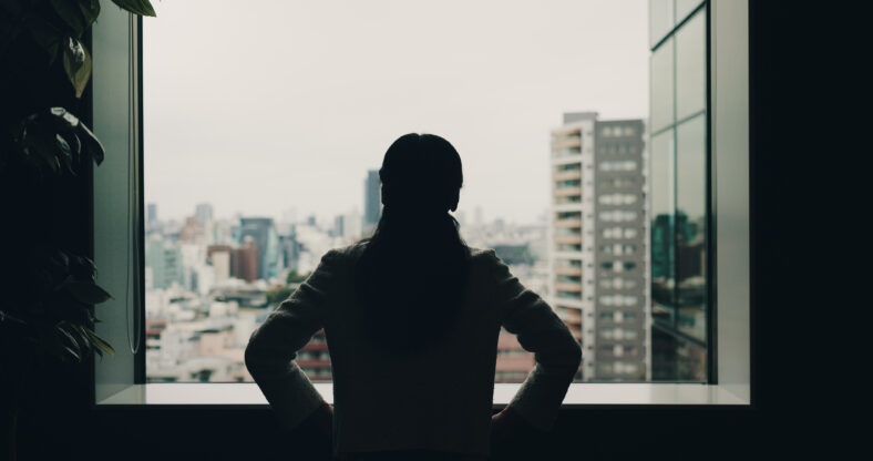 Back, thinking and window with business woman and Japan view for idea, reflection and corporate venture. Vision silhouette and memory with person and city for future, solution and confidence.