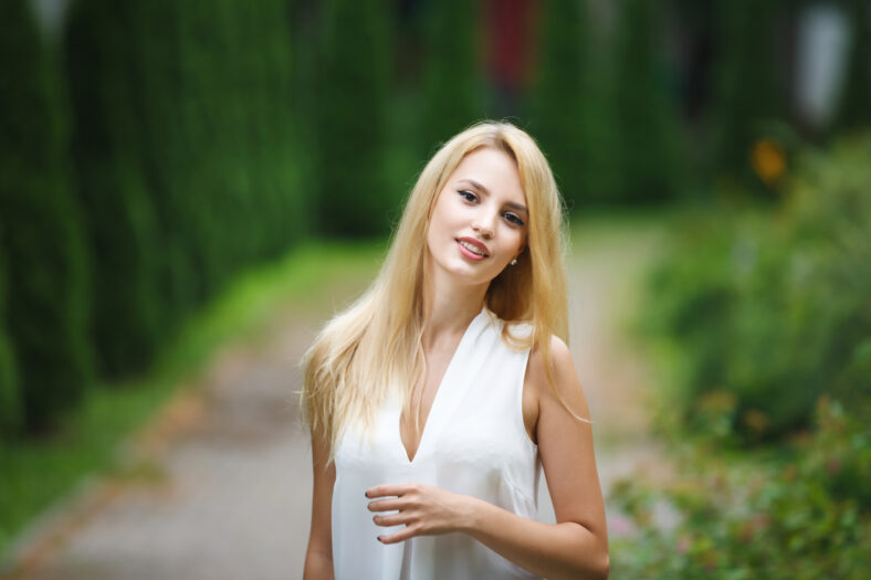 Portrait of adorable blonde woman outdoor, summer time