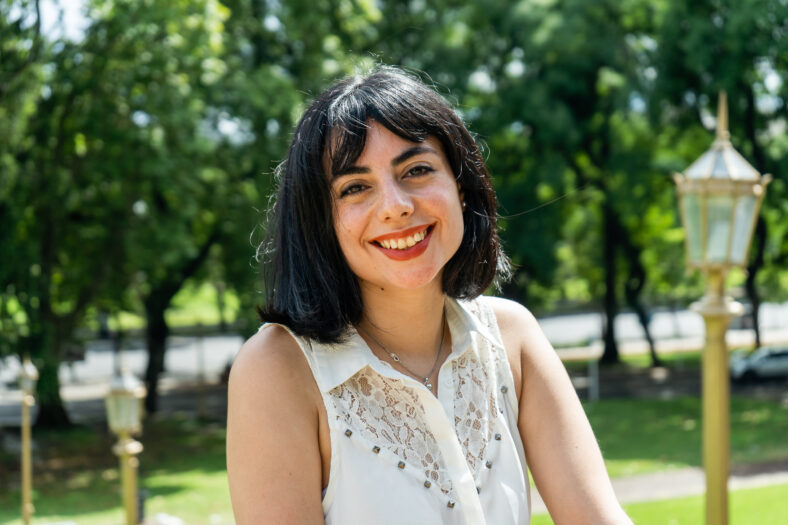 Portrait of a smiling latin woman enjoying a sunny day in a park in buenos aires
