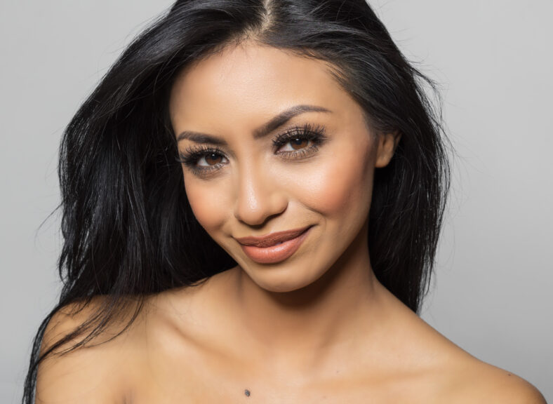 Beautiful woman with bare shoulders gorgeous hair