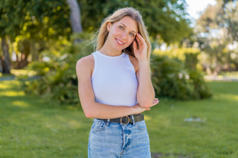 Young blonde woman at outdoors . Portrait
