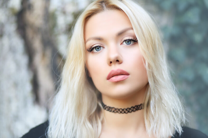 portrait of beautiful blond woman outdoor face close up