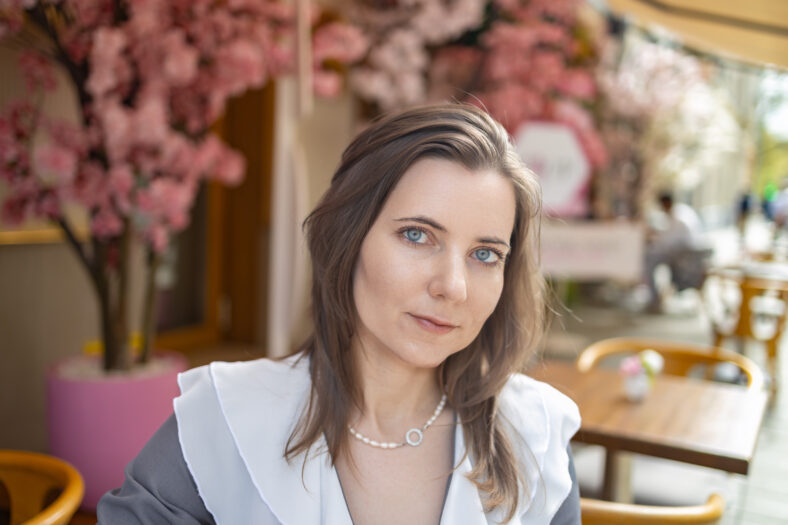 woman portrait in front of flowers