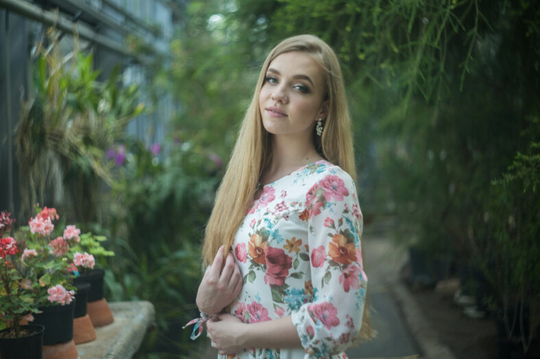 blonde woman portrait in greenhouse