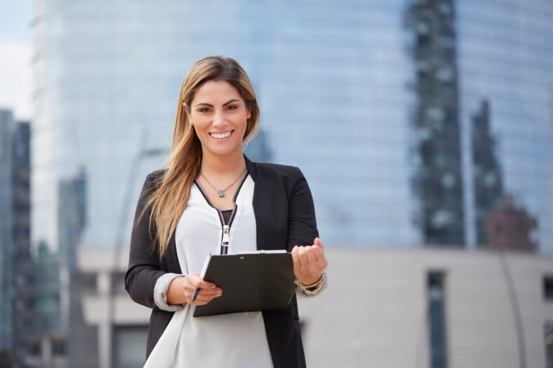 portrait of a professional business woman smiling outdoor