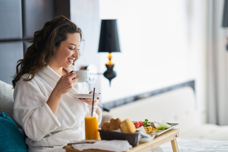 Breakfast in bed, cozy hotel room. concept