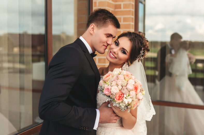 Happy bride and groom on their wedding. Close-up portrait