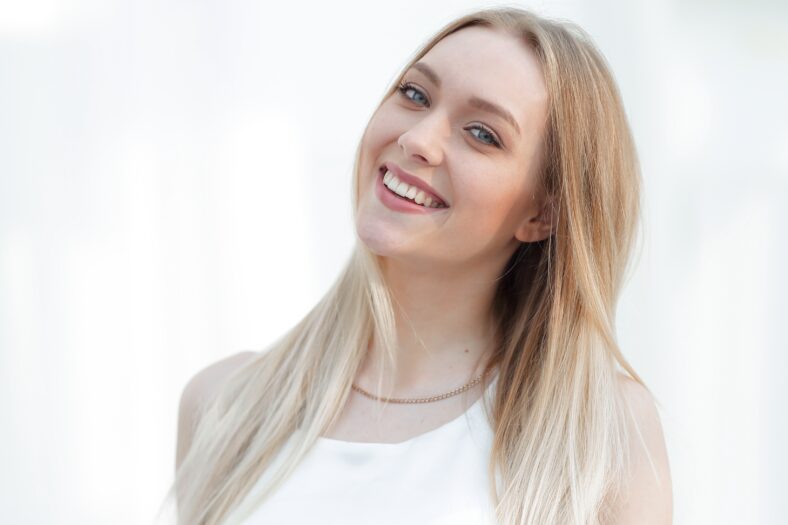 close-up portrait of an elegant young business woman. Photo has a blank space for text