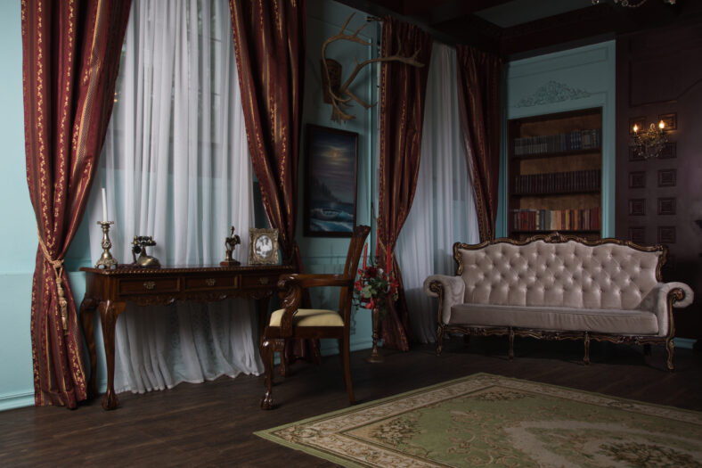 Classical library room with old books on shelves in the victorian style