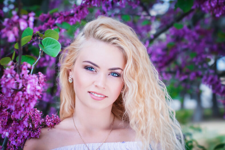 beautiful girl with lilac flowers