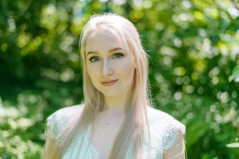 Summertime portrait of young woman in dress.