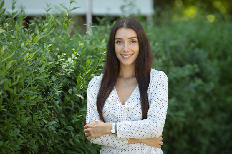 Outdoors portrait of beautiful young girl laughing
