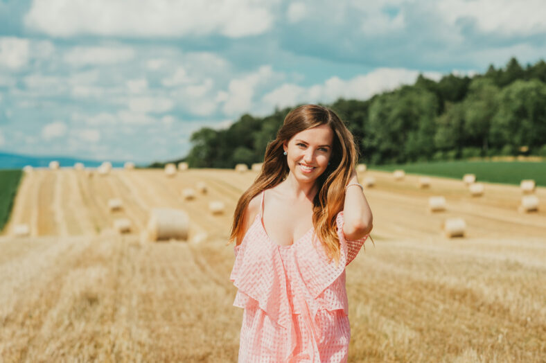 Outdoor portrait of beautiful young woman in countryside