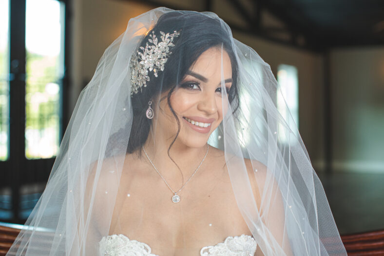 bride wearing a white dress and a veil