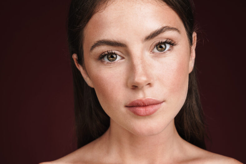 Image of beautiful woman posing and looking at camera
