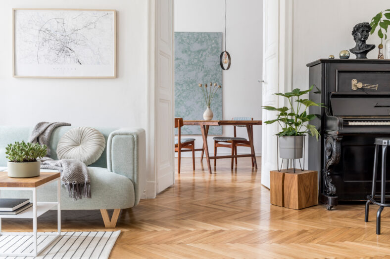 Stylish scandinavian living room with design mint sofa, furnitur