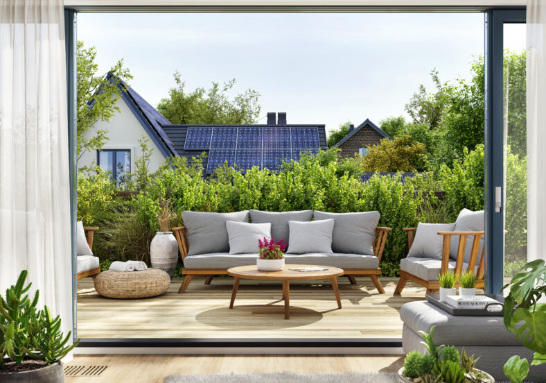 Rooftop patio with sliding doors and house with solar panels