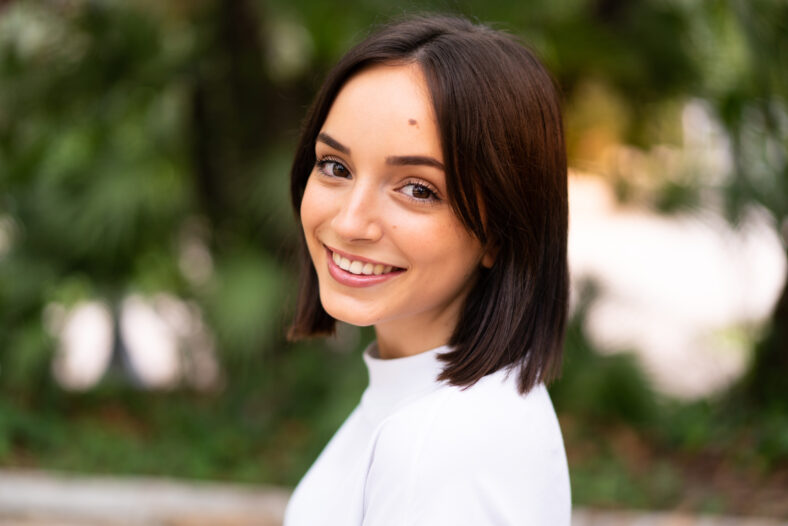Young happy caucasian woman at outdoors