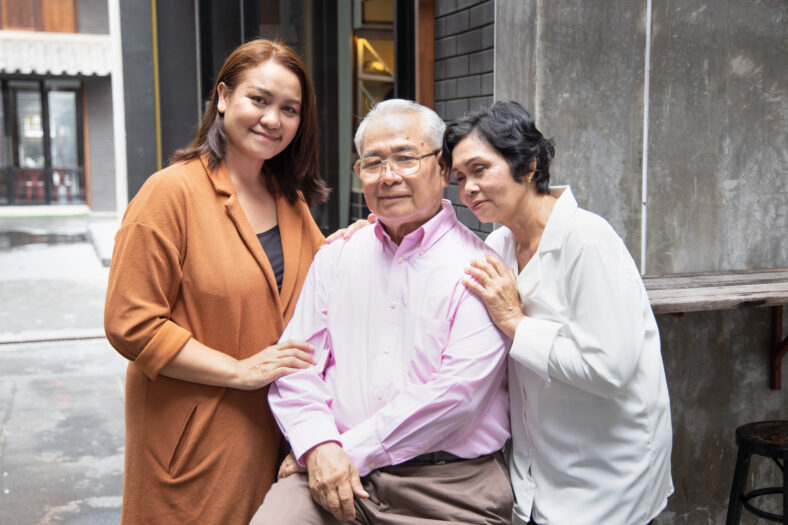 Asian family portrait of middle aged daughter with senior father and mother