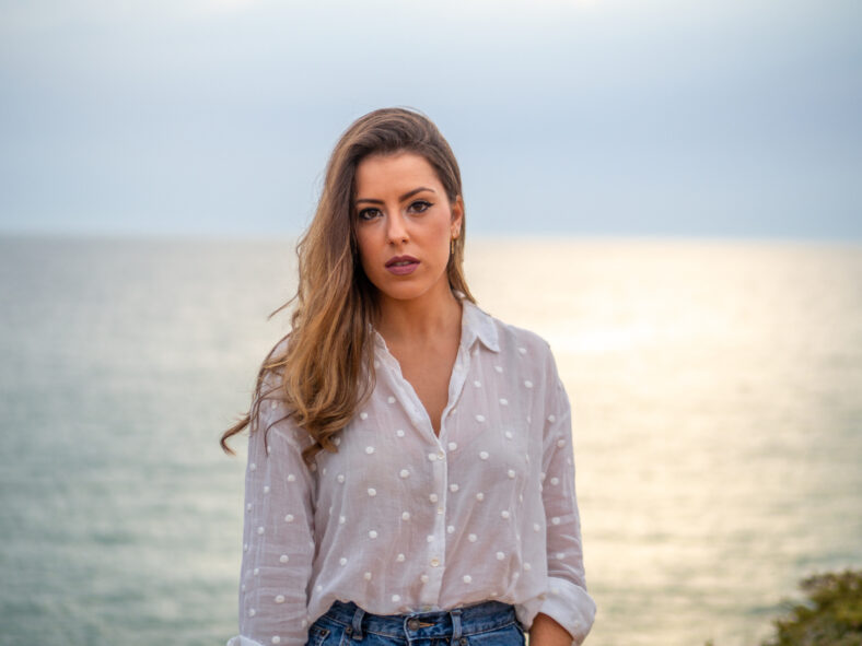 woman standing in front of a lake