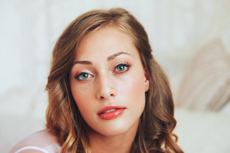 Wedding day and beautiful bride in studio. Beautiful young bride with wedding makeup and hairstyle. Portrait of young gorgeous bride. Wedding.