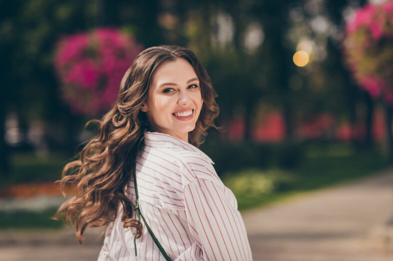 Rear behind view portrait of adorable brunette woman walk city central park active way life wear casual outfit outdoors.