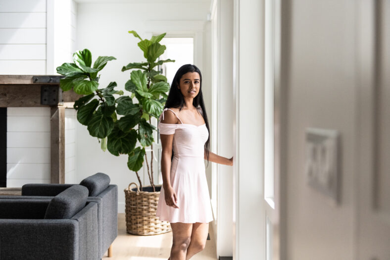 Woman in opening door to patio