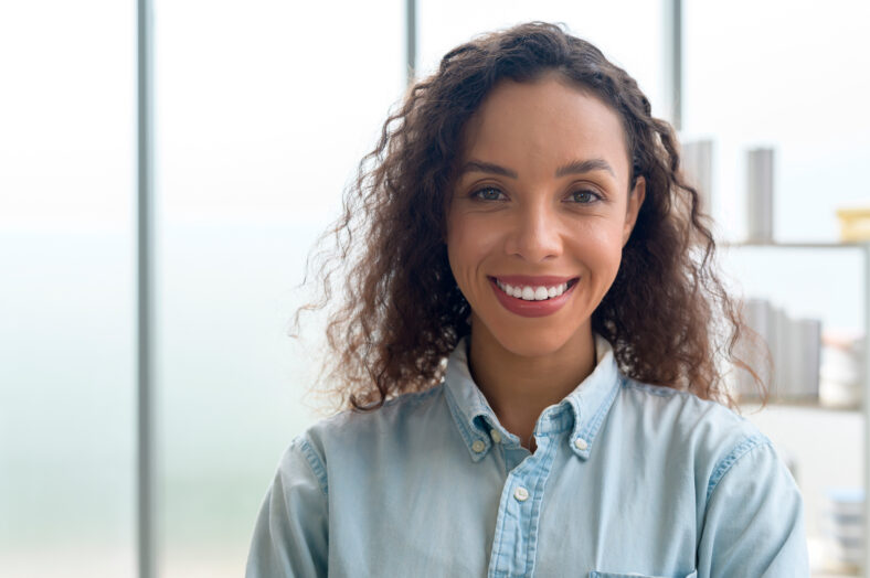 A portrait of young african businesswoman smiling in modern office