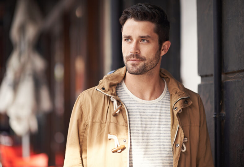 Cropped shot of a fashionable young man strolling through the city.