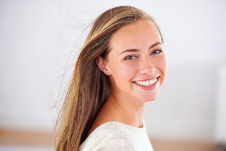 Portrait of an attractive young woman giving you a bright smile.